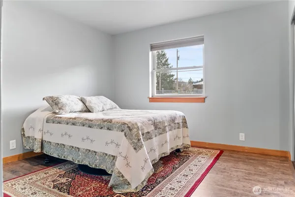 a bedroom with bed and a window