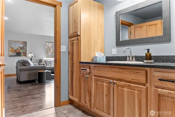 a bathroom with a sink and a mirror