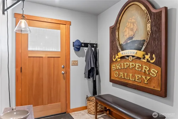 a view of a hallway with wooden door