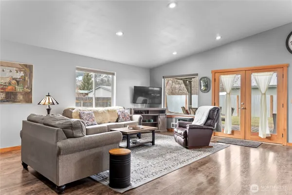 a living room with furniture and a flat screen tv