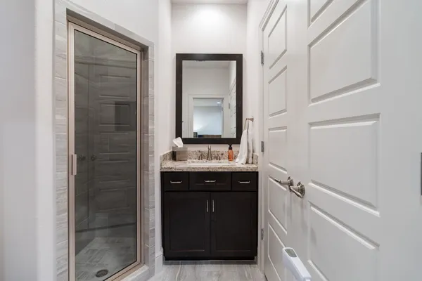 a bathroom with a sink and a mirror