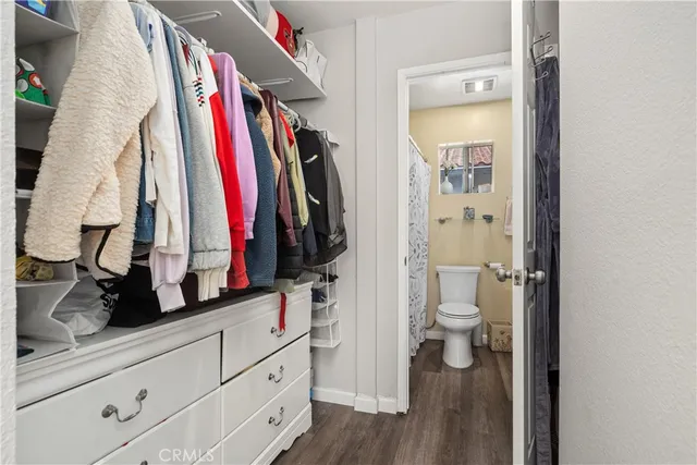 a bathroom with a sink toilet and a mirror