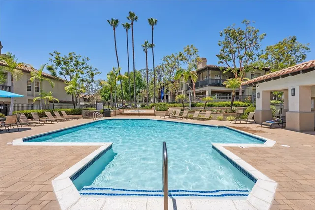a view of a swimming pool with a patio