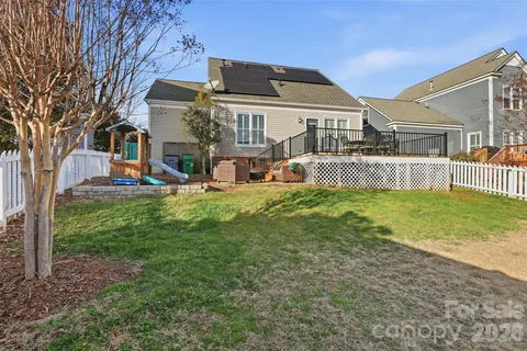 a front view of house with yard and outdoor seating