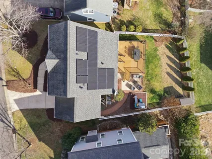 an aerial view of residential houses with outdoor space