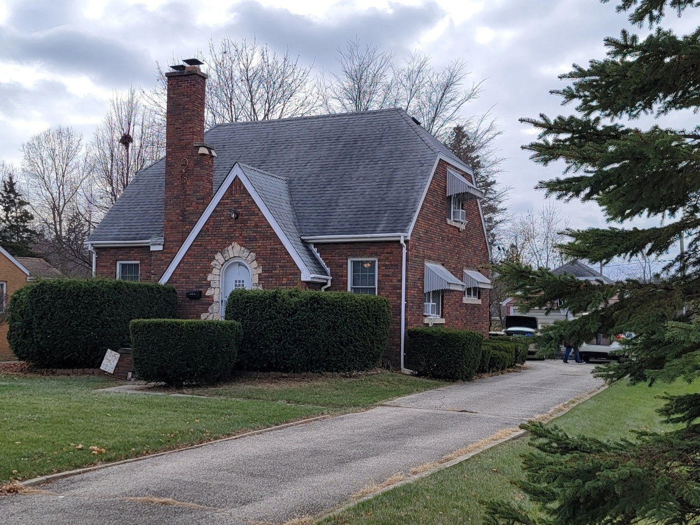 a front view of a house with a garden