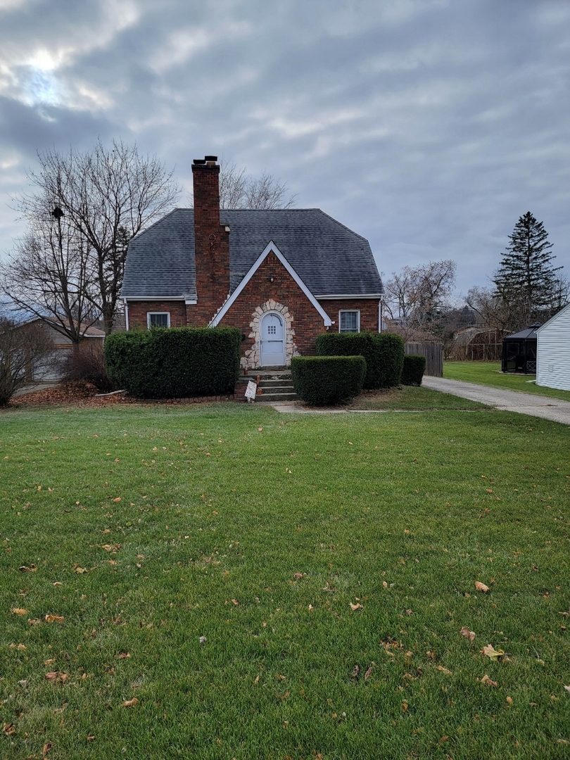 405 Opatrny Drive Fox River Grove, IL 60021 - Photo 2 of 9 a front view of a house with a yard