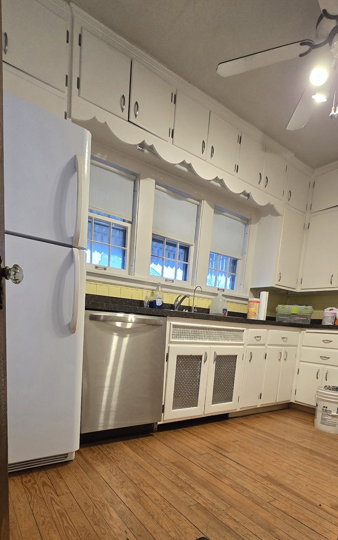 405 Opatrny Drive Fox River Grove, IL 60021 - Photo 3 of 9 a kitchen with stainless steel appliances granite countertop a sink and cabinets