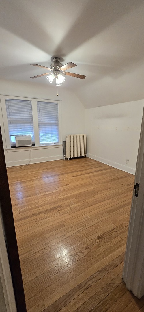 405 Opatrny Drive Fox River Grove, IL 60021 - Photo 5 of 9 a view of an empty room with wooden floor and a window