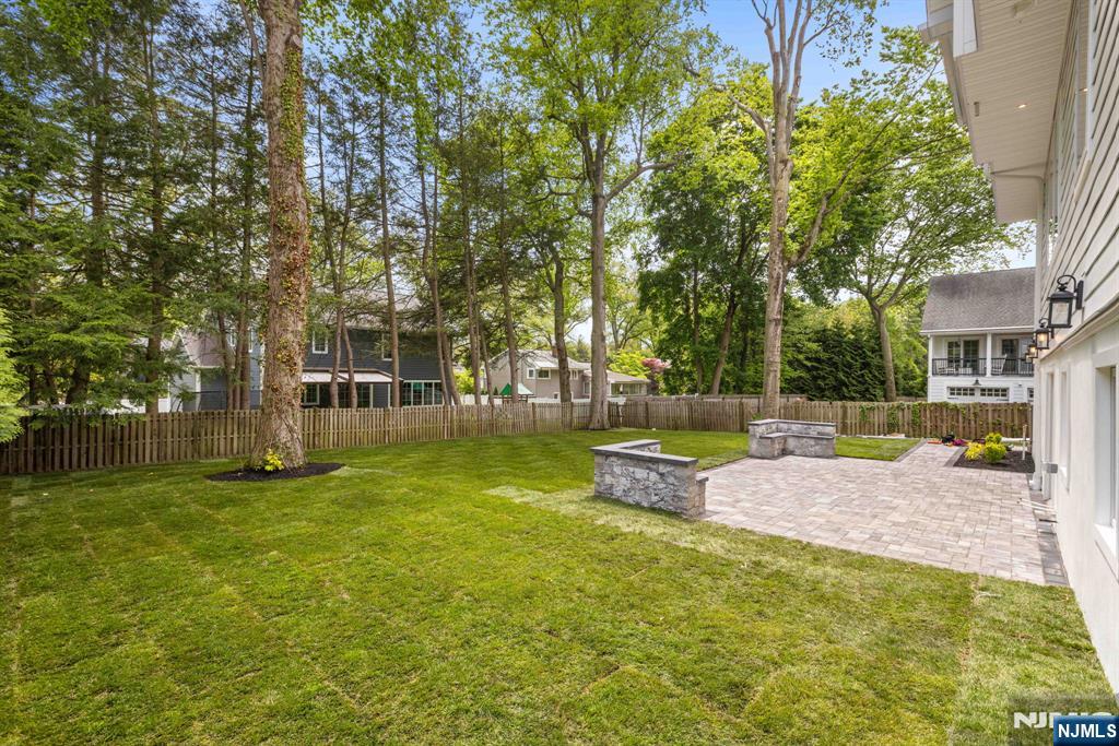 14 Beechwood Road Ho-Ho-Kus, NJ 07423 - Photo 28 of 31 a view of a house with swimming pool and sitting area