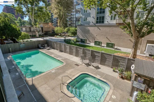 swimming pool view with a seating space