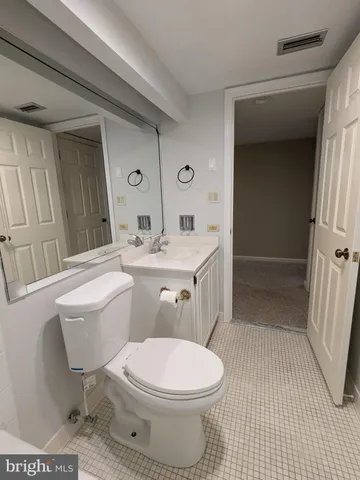 a room with a sink and a mirror