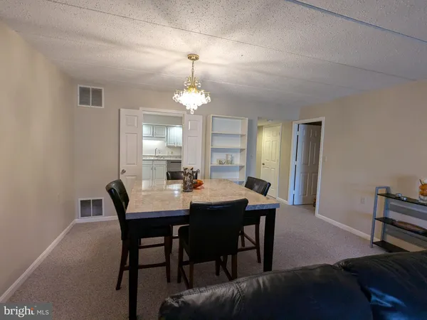 a large kitchen with cabinets and stainless steel appliances