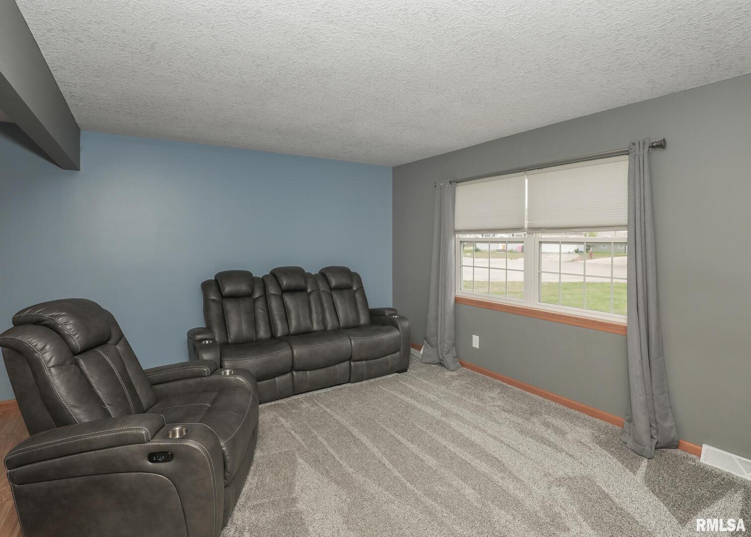 330 Sullivan Drive Colona, IL 61241 - Photo 11 of 31 a bedroom with furniture and a window