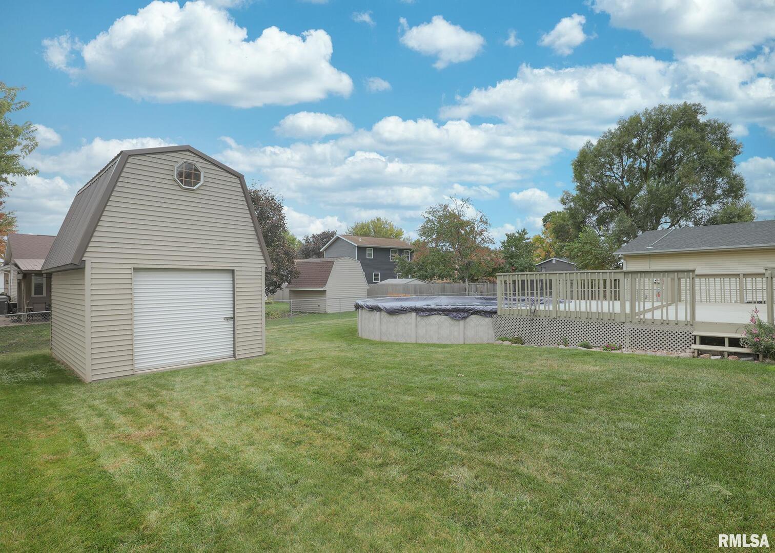 330 Sullivan Drive Colona, IL 61241 - Photo 7 of 31 a view of a backyard