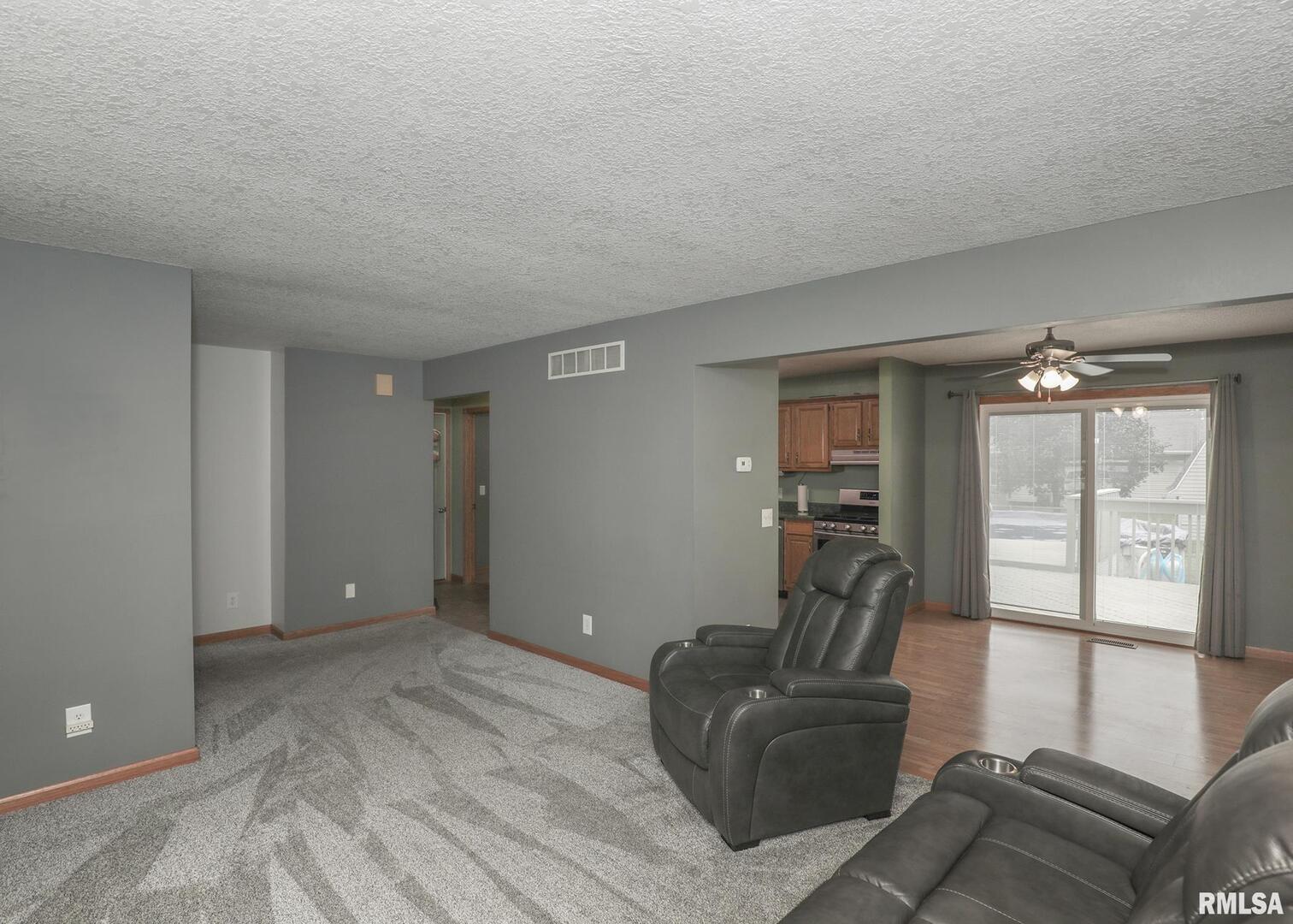 330 Sullivan Drive Colona, IL 61241 - Photo 9 of 31 a living room with furniture and a window