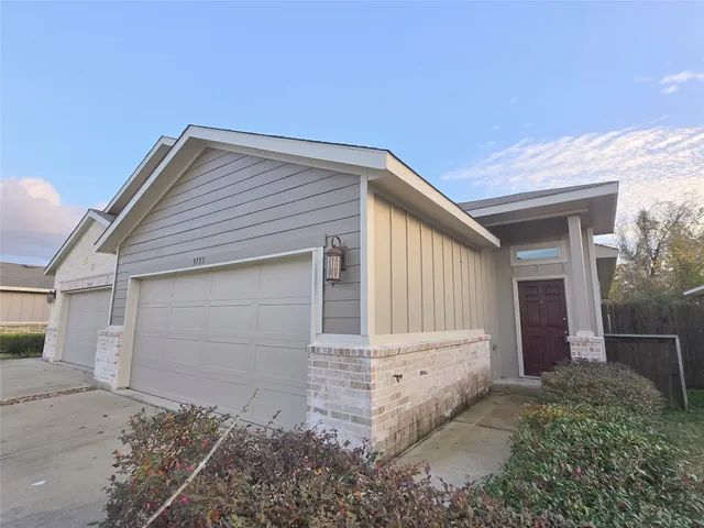a front view of house with small garden