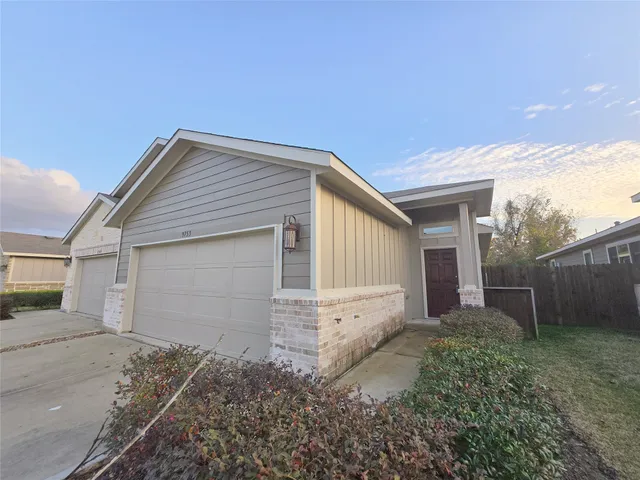 a front view of house with small garden