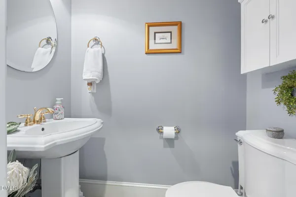 a view of a dining room with furniture wooden floor and chandelier