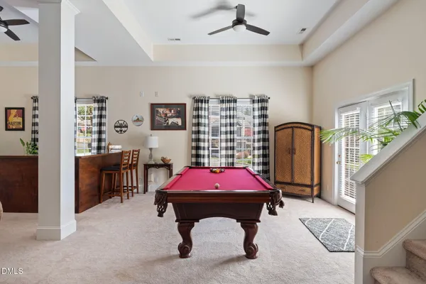 a view of bathroom with a toilet a sink and shower