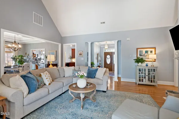a living room with fireplace furniture and a flat screen tv