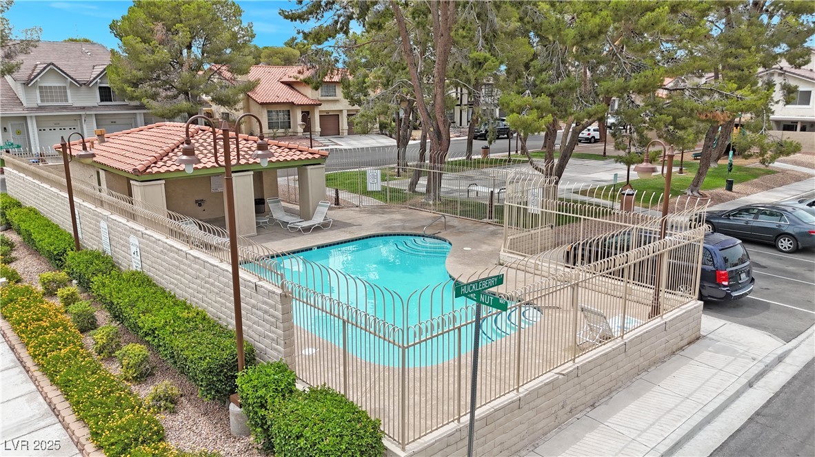 117 Boysenberry Lane Henderson, NV 89074 - Photo 5 of 22 Community pool featuring a patio and a residential view