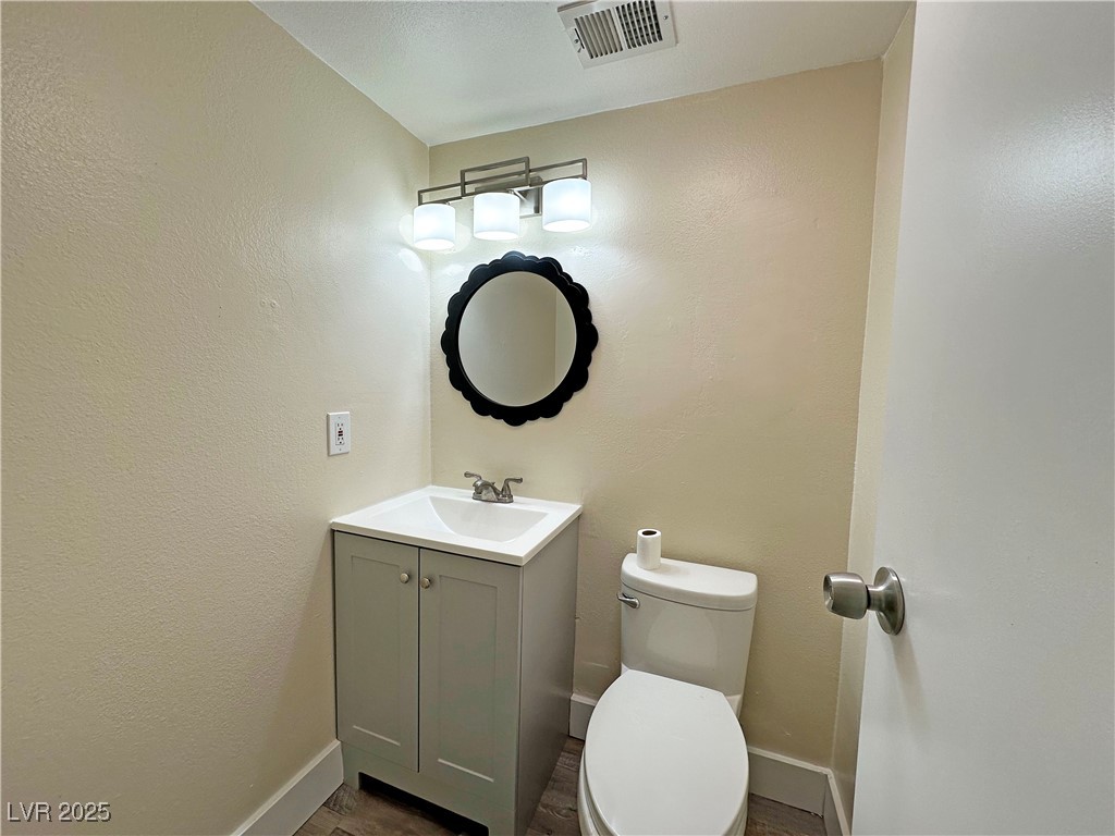 117 Boysenberry Lane Henderson, NV 89074 - Photo 9 of 22 Bathroom featuring vanity and a textured wall