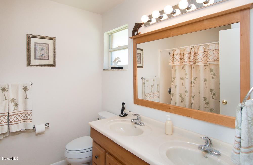 290 Riggs Avenue Melbourne Beach, FL 32951 - Photo 11 of 19 GUEST BATHROOM W/ DOUBLE SINKS!