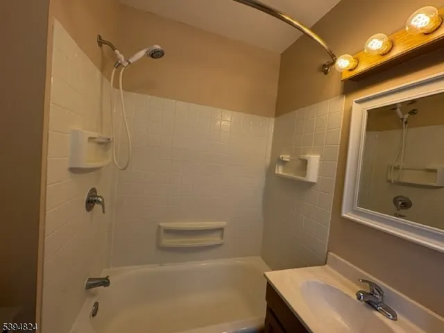 a bathroom with a sink and shower
