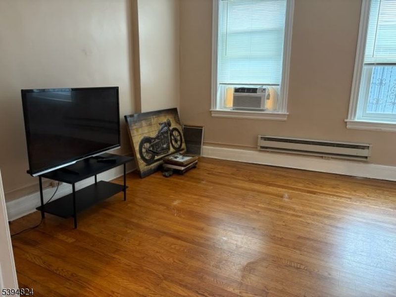 9 Moran Street, Unit 2 Newton, NJ 07860 - Photo 4 of 13 a living room with furniture and a flat screen tv