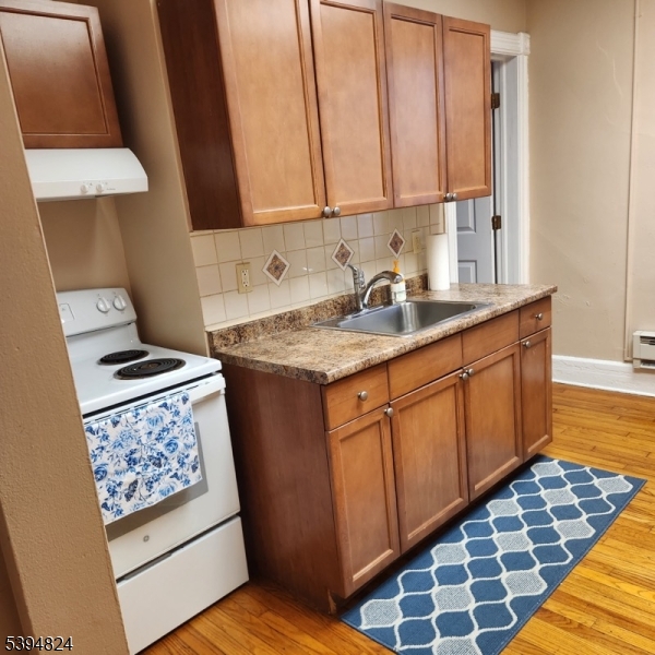 9 Moran Street, Unit 2 Newton, NJ 07860 - Photo 9 of 13 a kitchen with sink cabinets and stove