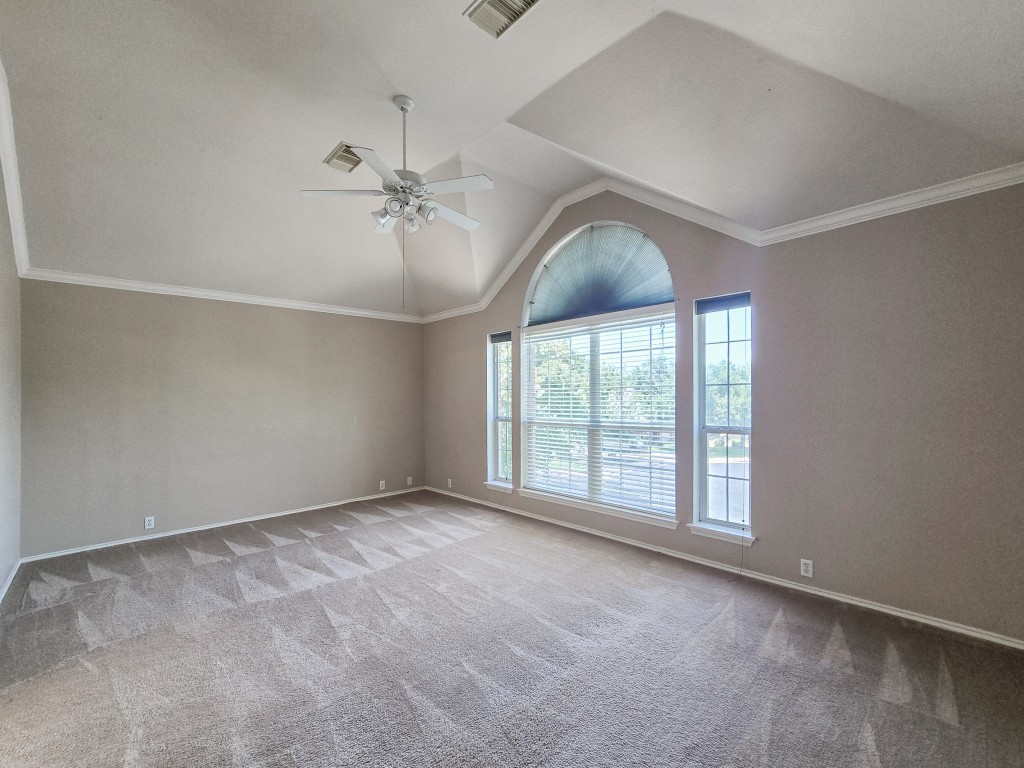17692 Box Canyon Terrace Round Rock, TX 78681 - Photo 17 of 26 an empty room with windows and ceiling fan