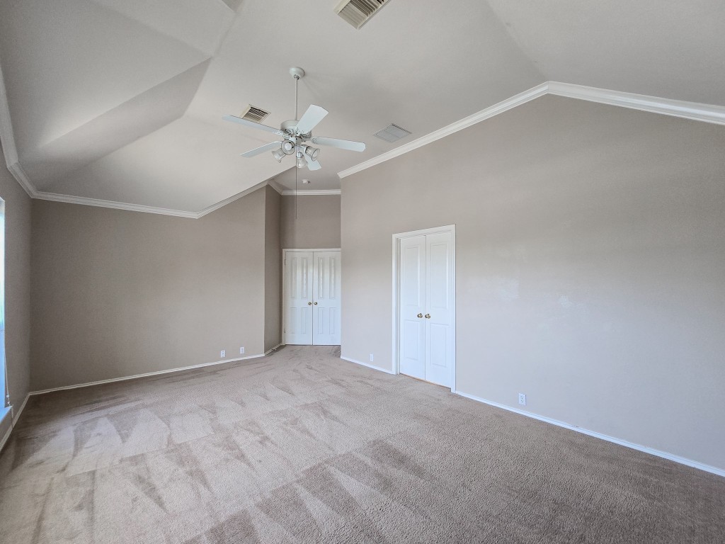 17692 Box Canyon Terrace Round Rock, TX 78681 - Photo 18 of 26 a view of an empty room with a ceiling fan and window