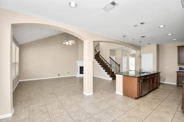 a view of kitchen with microwave and cabinets