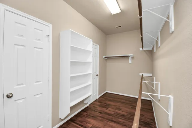 a view of an empty walk in closet