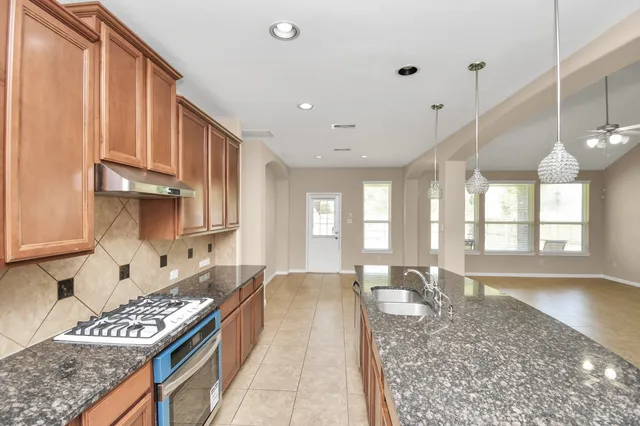 a large kitchen with a large window