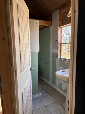 a white toilet sitting next to a bath tub