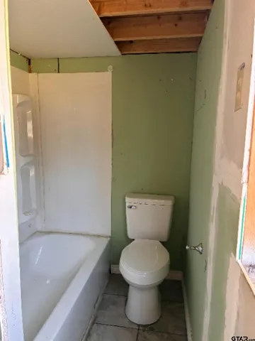 a view of a yard with potted plants