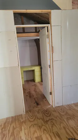 a view of entryway with wooden floor