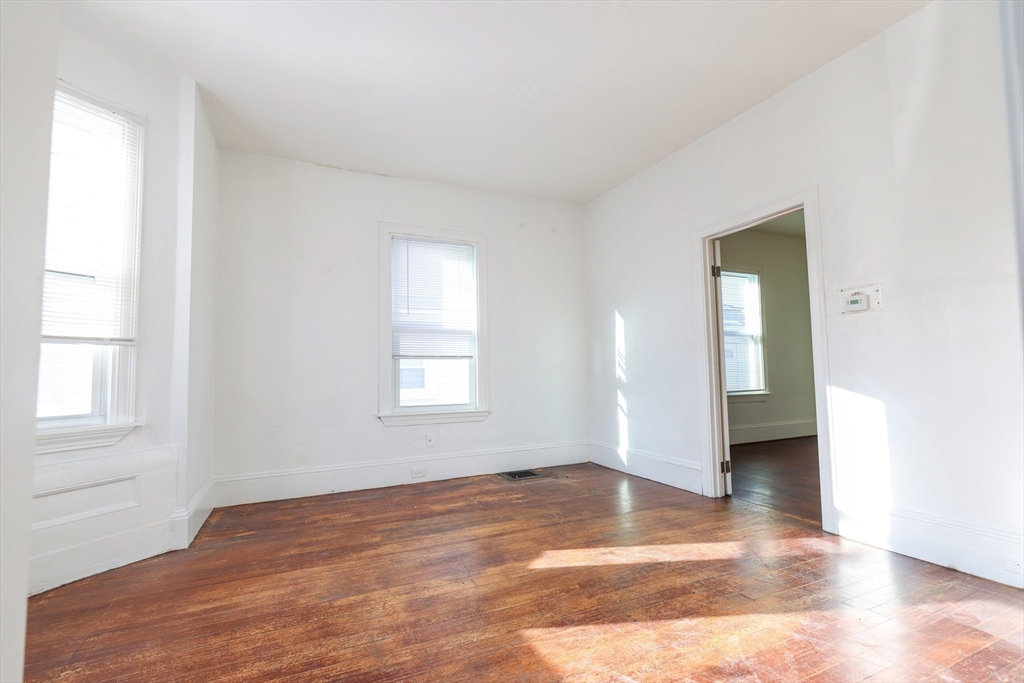 68 Newhall Street, Unit 68 Malden, MA 02148 - Photo 7 of 39 an empty room with windows and closet