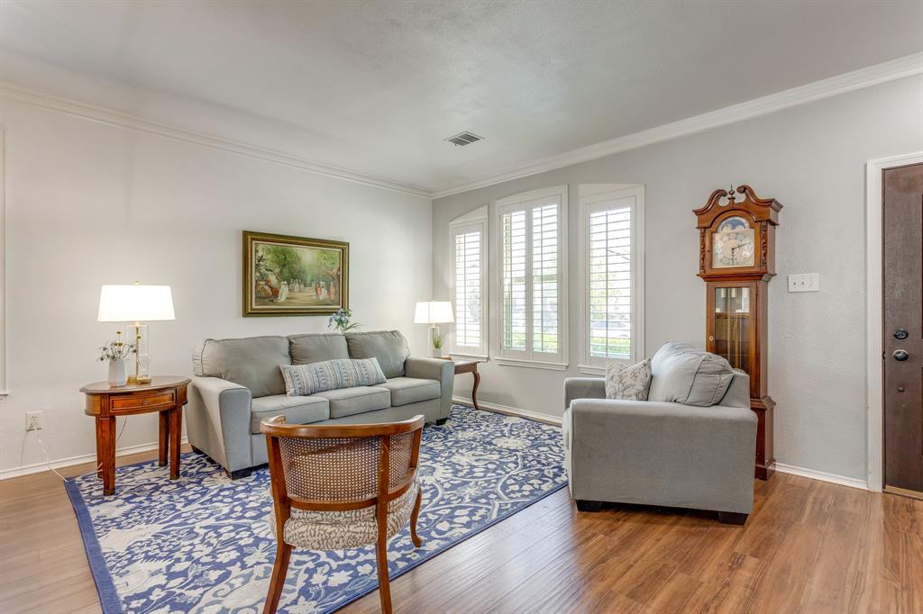 4816 Sleepy Ridge Circle Fort Worth, TX 76133 - Photo 5 of 36 Living area with ornamental molding and wood finished floors