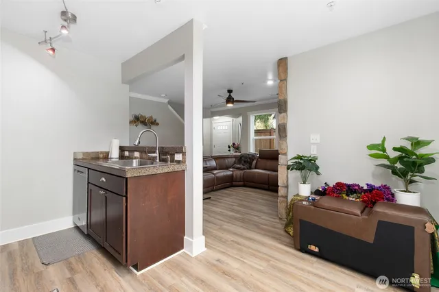 a living room with furniture and a potted plant