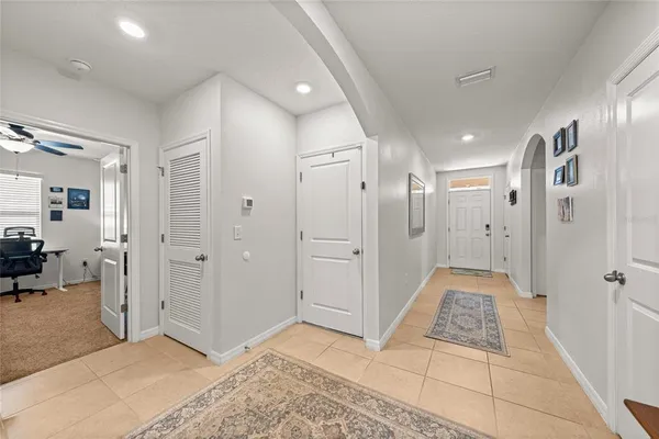 a spacious bathroom with a glass shower door and a sink