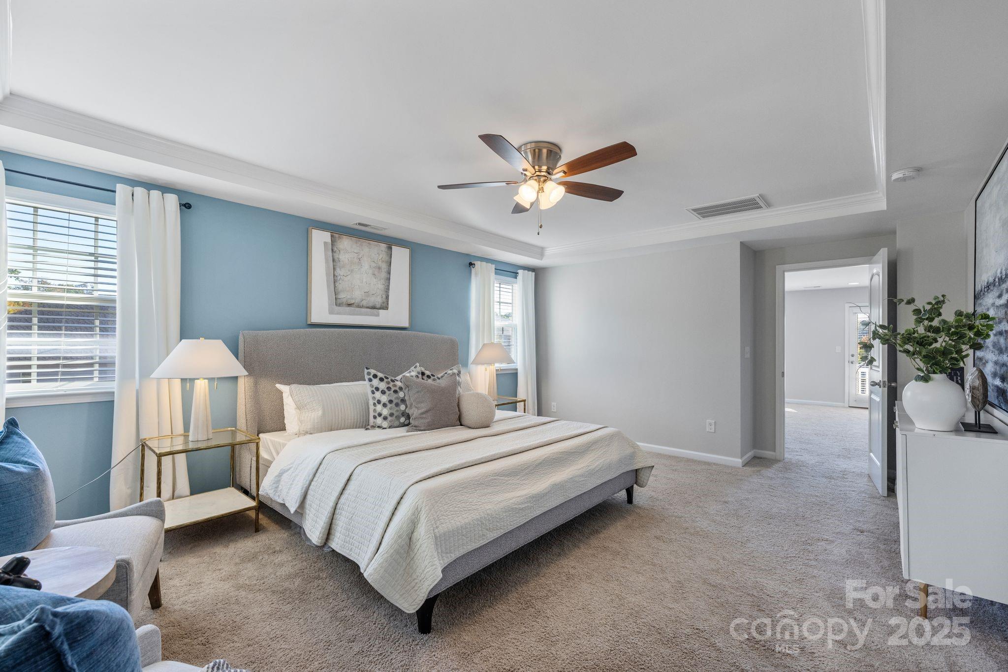 232 Morgan's Branch Road Belmont, NC 28012 - Photo 17 of 40 a bedroom with a bed chandelier and a window