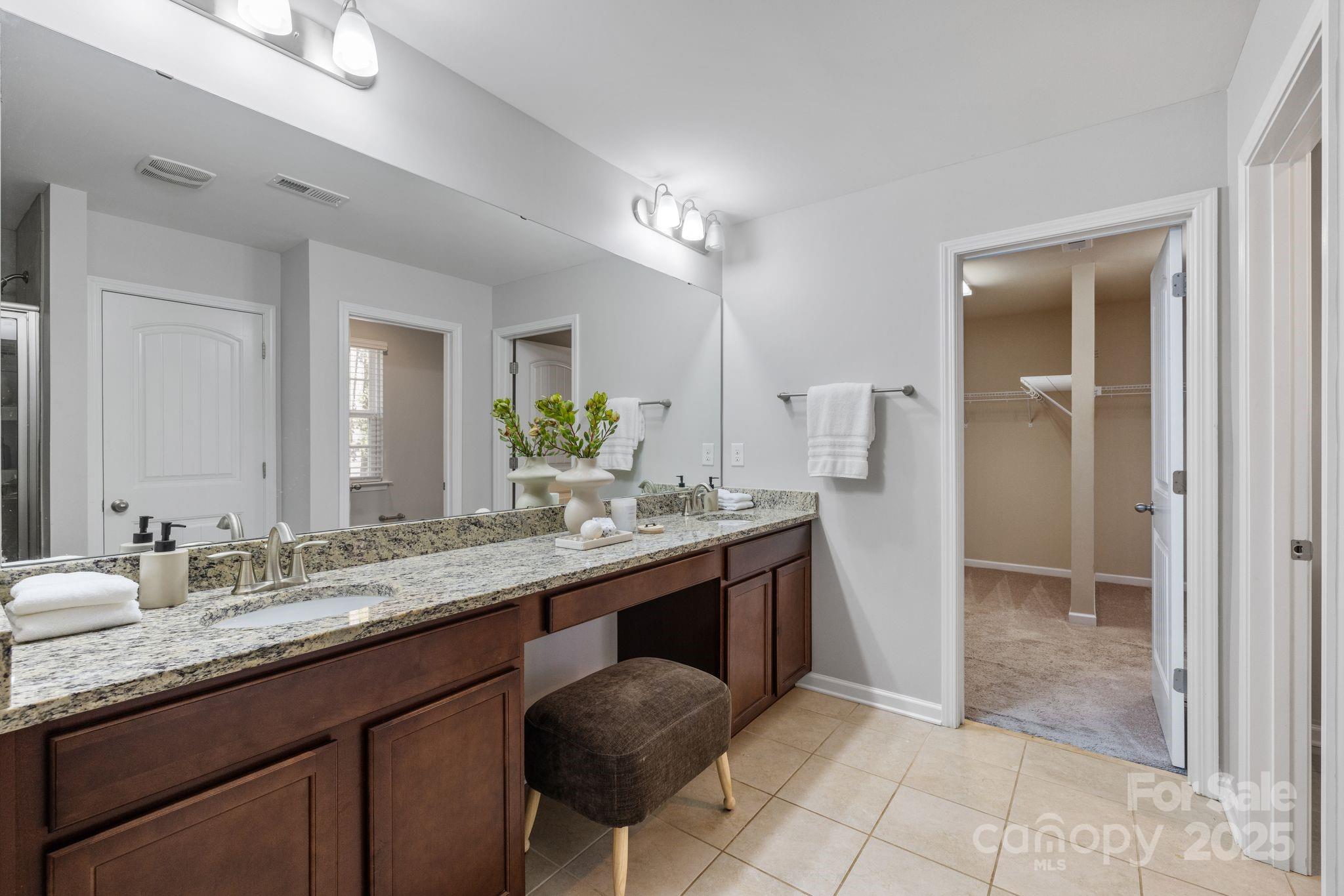 232 Morgan's Branch Road Belmont, NC 28012 - Photo 19 of 40 a bathroom with a granite countertop sink and a mirror