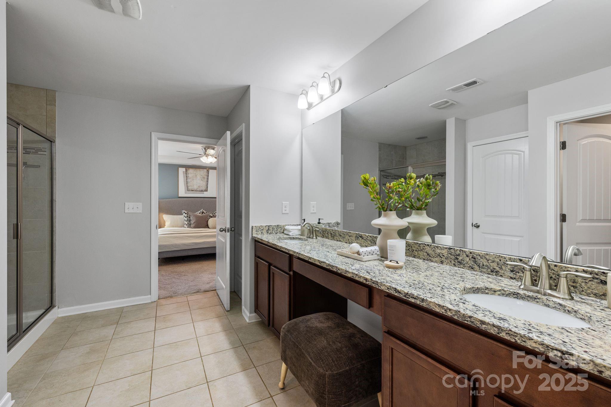 232 Morgan's Branch Road Belmont, NC 28012 - Photo 20 of 40 a bathroom with a granite countertop sink and a mirror