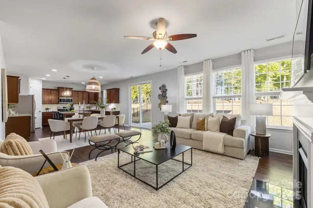 a kitchen with stainless steel appliances granite countertop wooden cabinets a sink and a stove