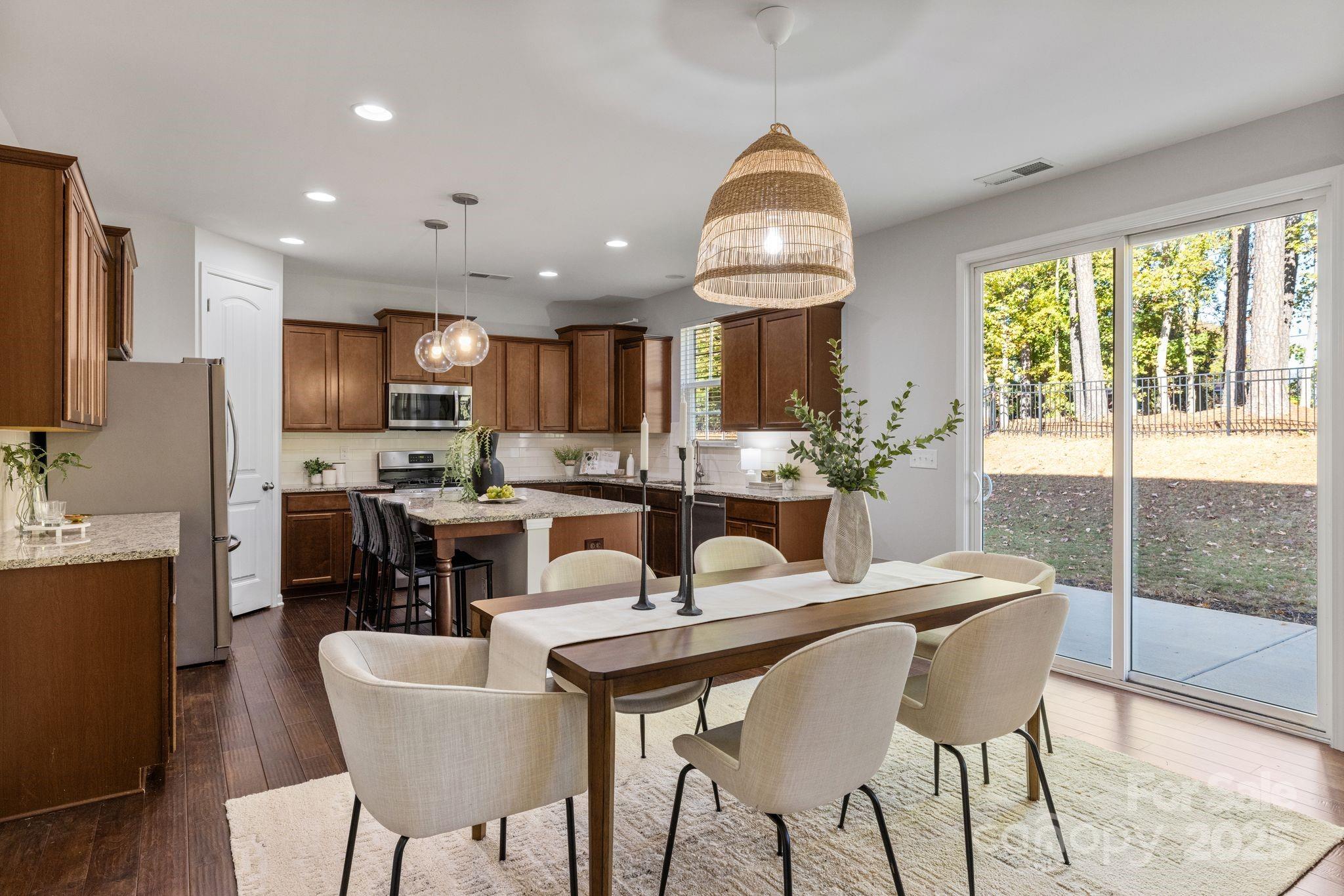 232 Morgan's Branch Road Belmont, NC 28012 - Photo 6 of 40 a view of a dining room with furniture window and outside view