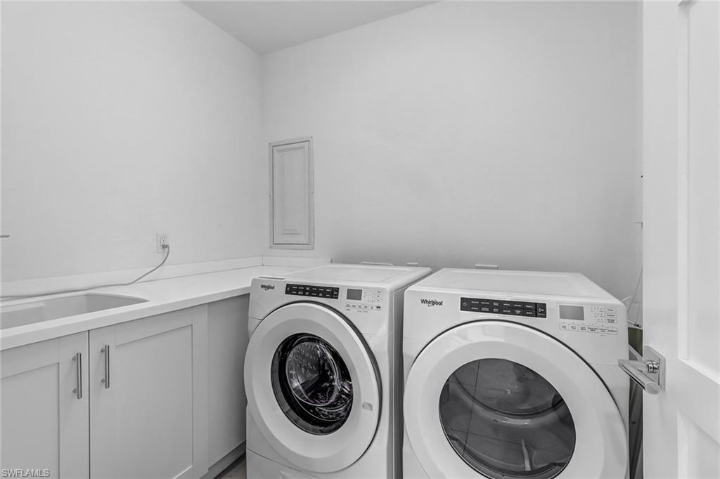 1135 3rd Avenue South, Unit 415 Naples, FL 34102 - Photo 12 of 25 a utility room with dryer and washer