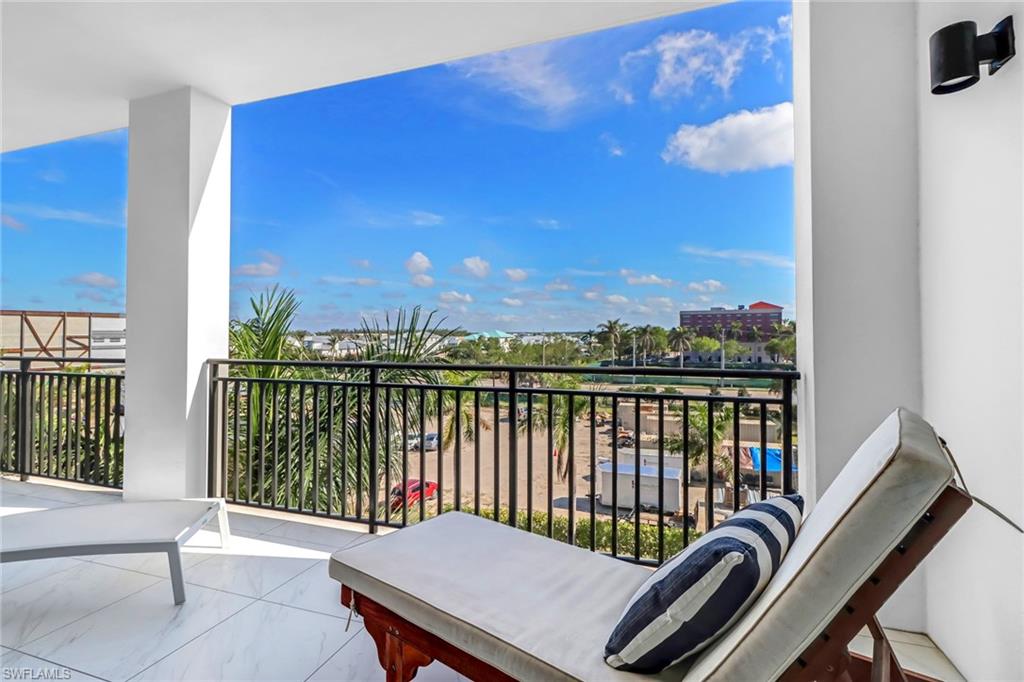 1135 3rd Avenue South, Unit 415 Naples, FL 34102 - Photo 20 of 25 a view of a balcony with furniture
